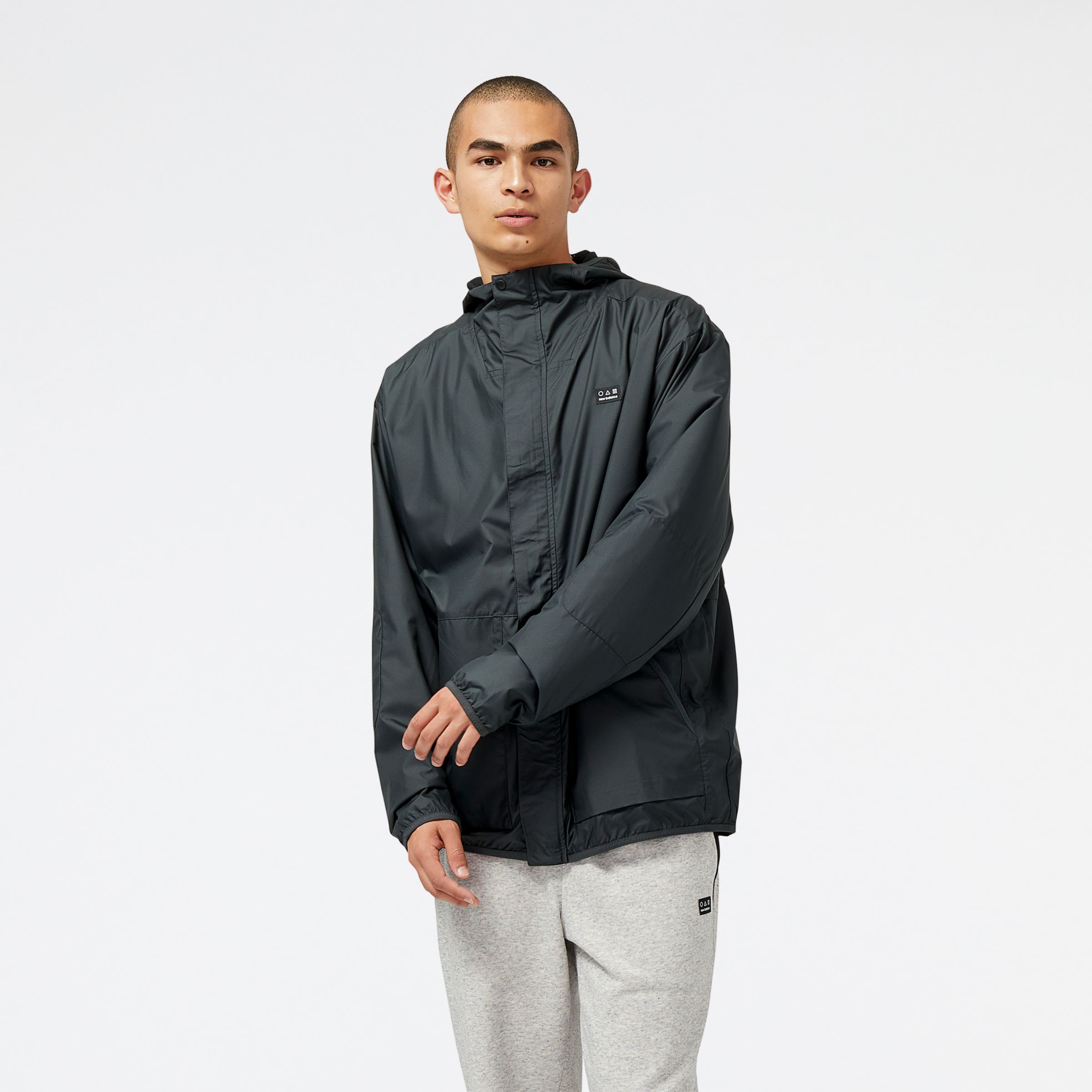 New Balance Homens Jaqueta AT Woven in Preto, Polywoven, Tamanho L