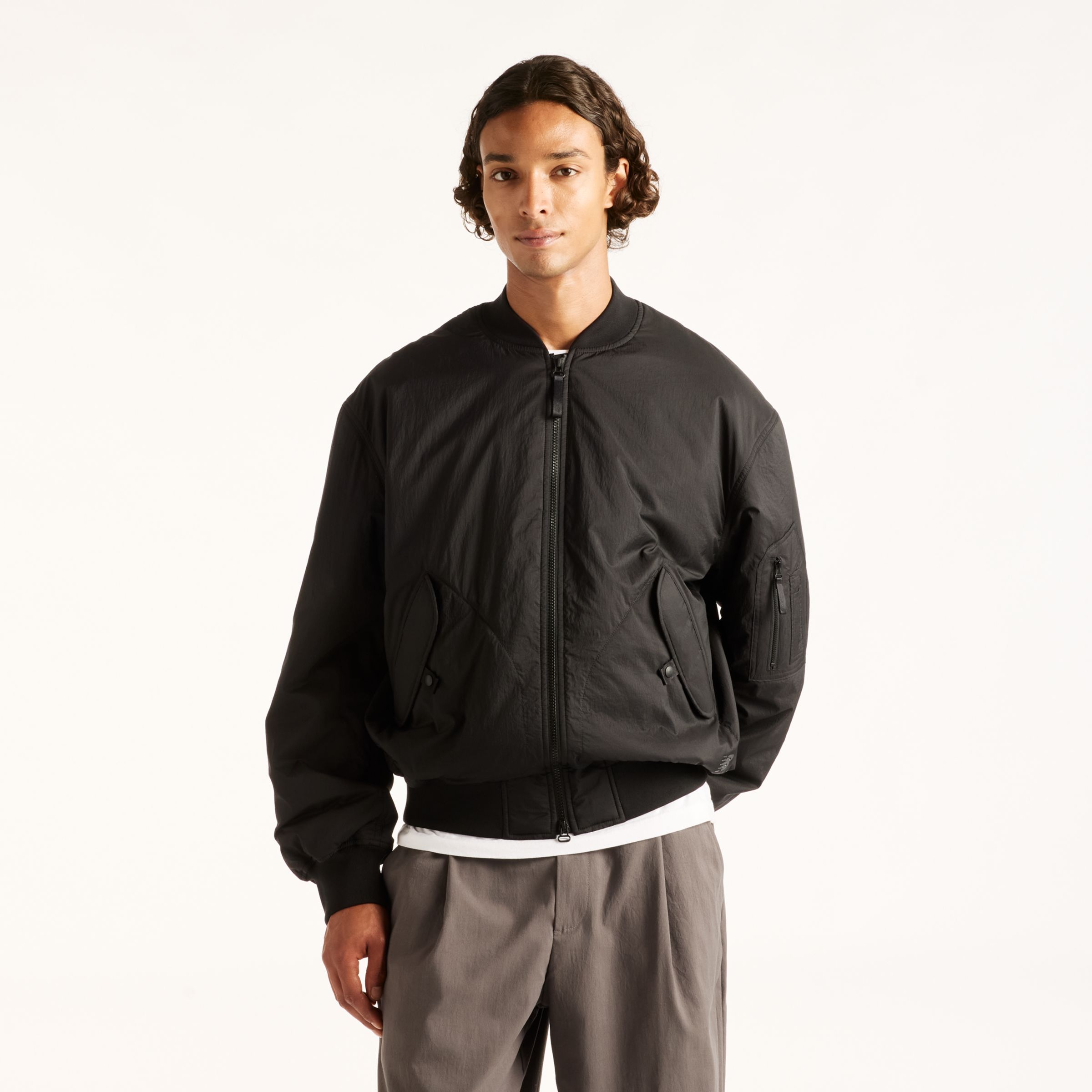 Djairo is wearing size M and is 6'0.5"/184cm. Chest: 37.25"/95cm, Waist: 29.5"/75cm, Hips: 37"/94cm