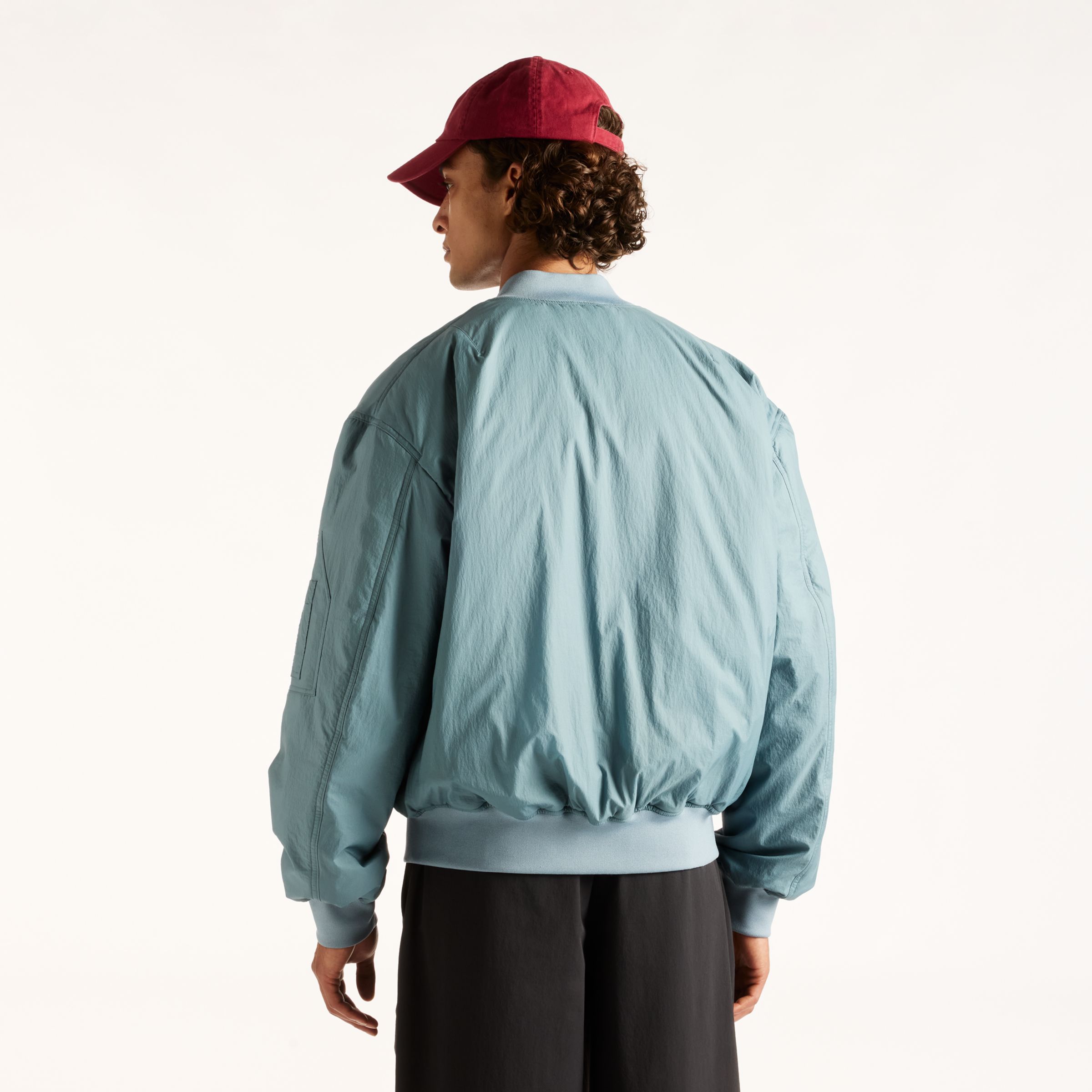 Djairo is wearing size M and is 6'0.5"/184cm. Chest: 37.25"/95cm, Waist: 29.5"/75cm, Hips: 37"/94cm