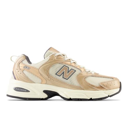 New balance store shoes gold