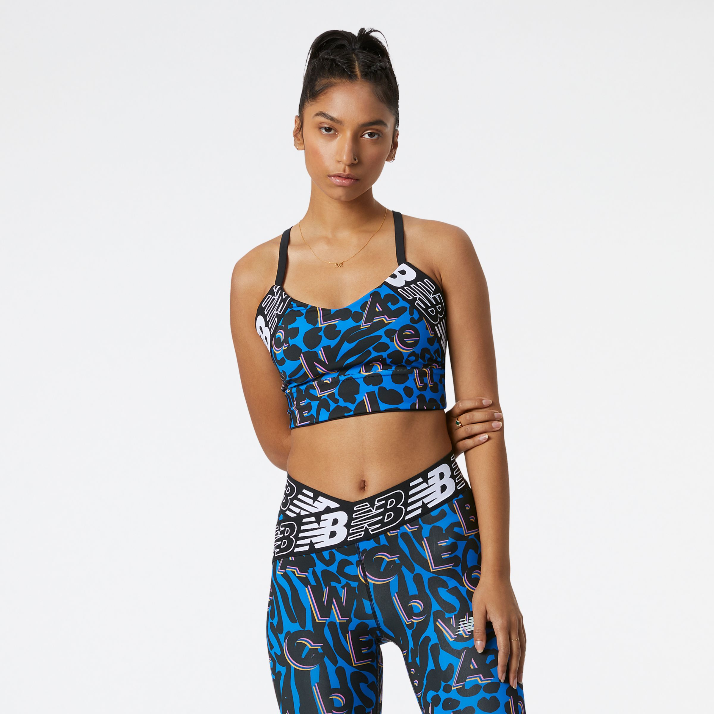 New Balance Mulheres Relentless Printed Crop Bra in Azul, Poly Knit, Tamanho M
