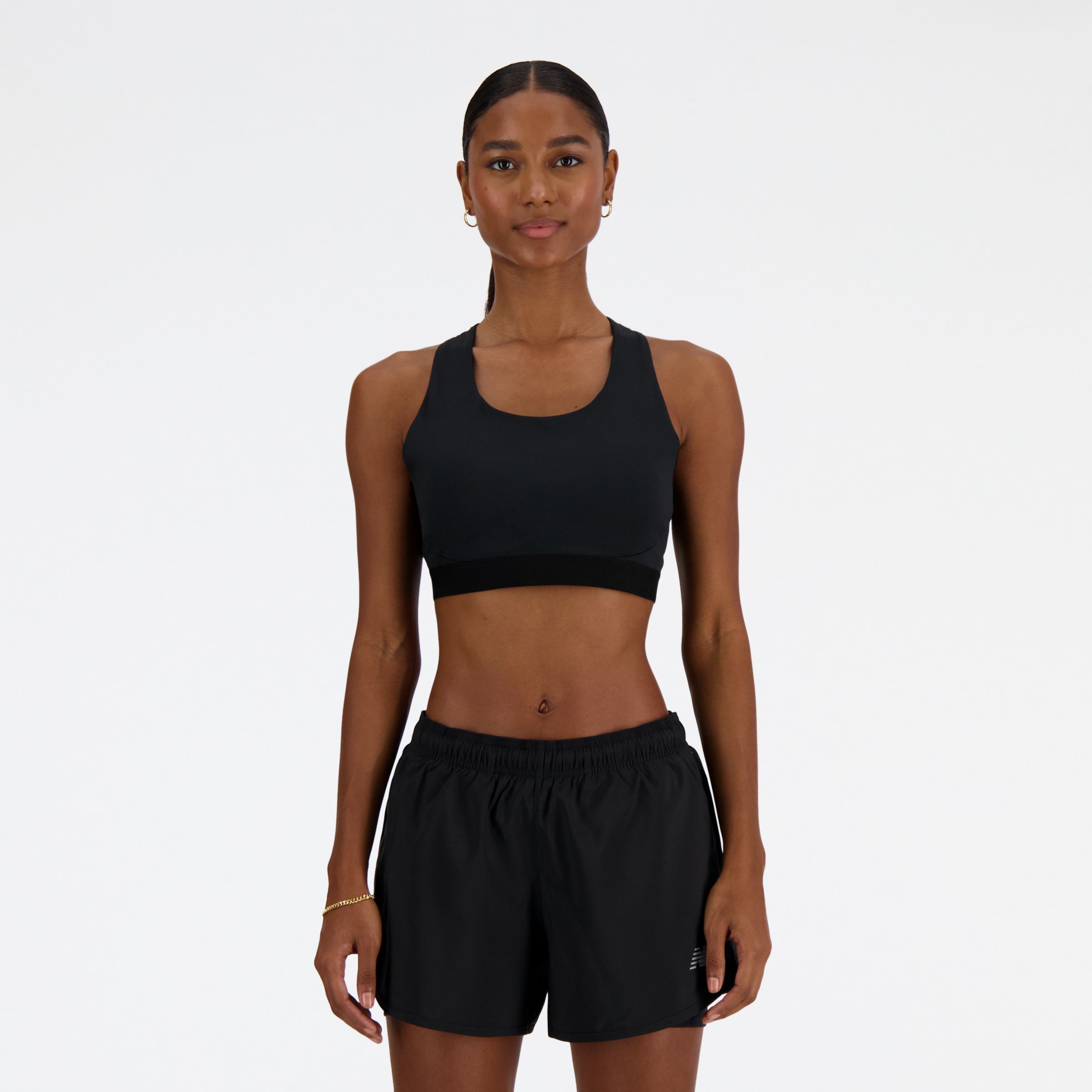 New Balance Women's NB Sleek Medium Support Pocket Sports Bra in Black Poly Knit, size X-Small