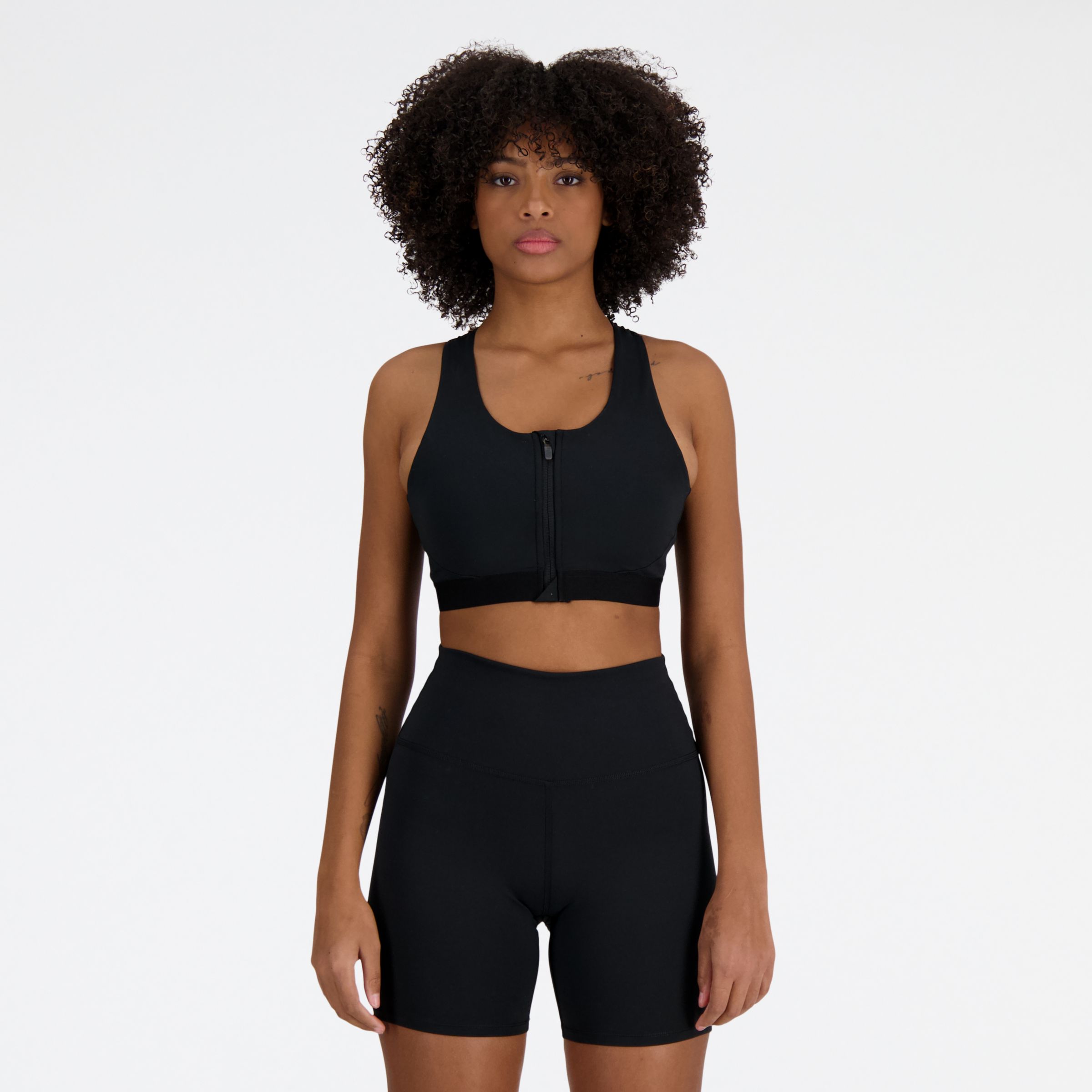 new balance femme nb sleek medium support pocket zip front bra en noir, poly knit, taille m