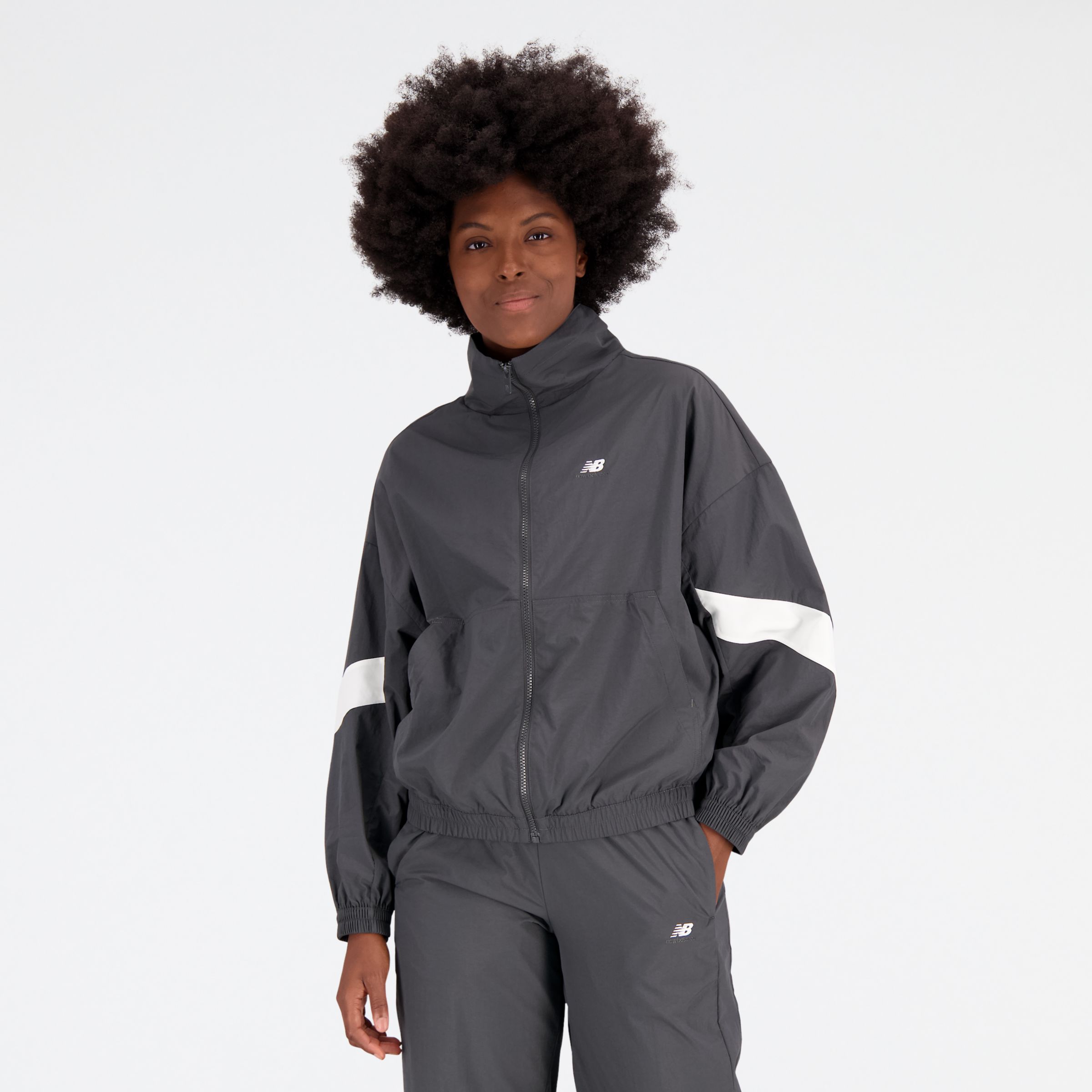 New Balance Women's Athletics Remastered Woven Jacket in Black Polywoven, size Medium
