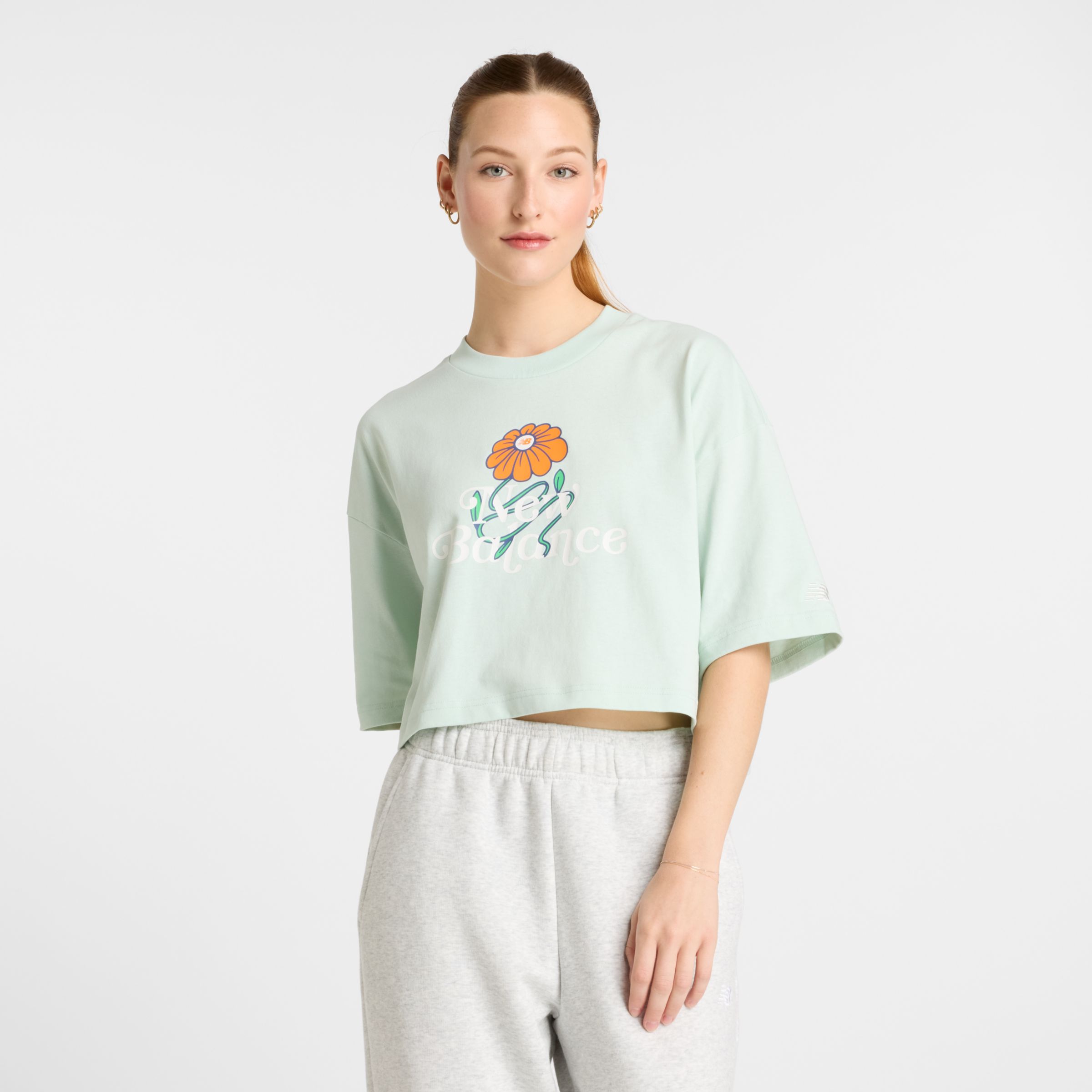 NEW BALANCE WOMEN'S ATHLETICS FLOWER CROPPED T-SHIRT 