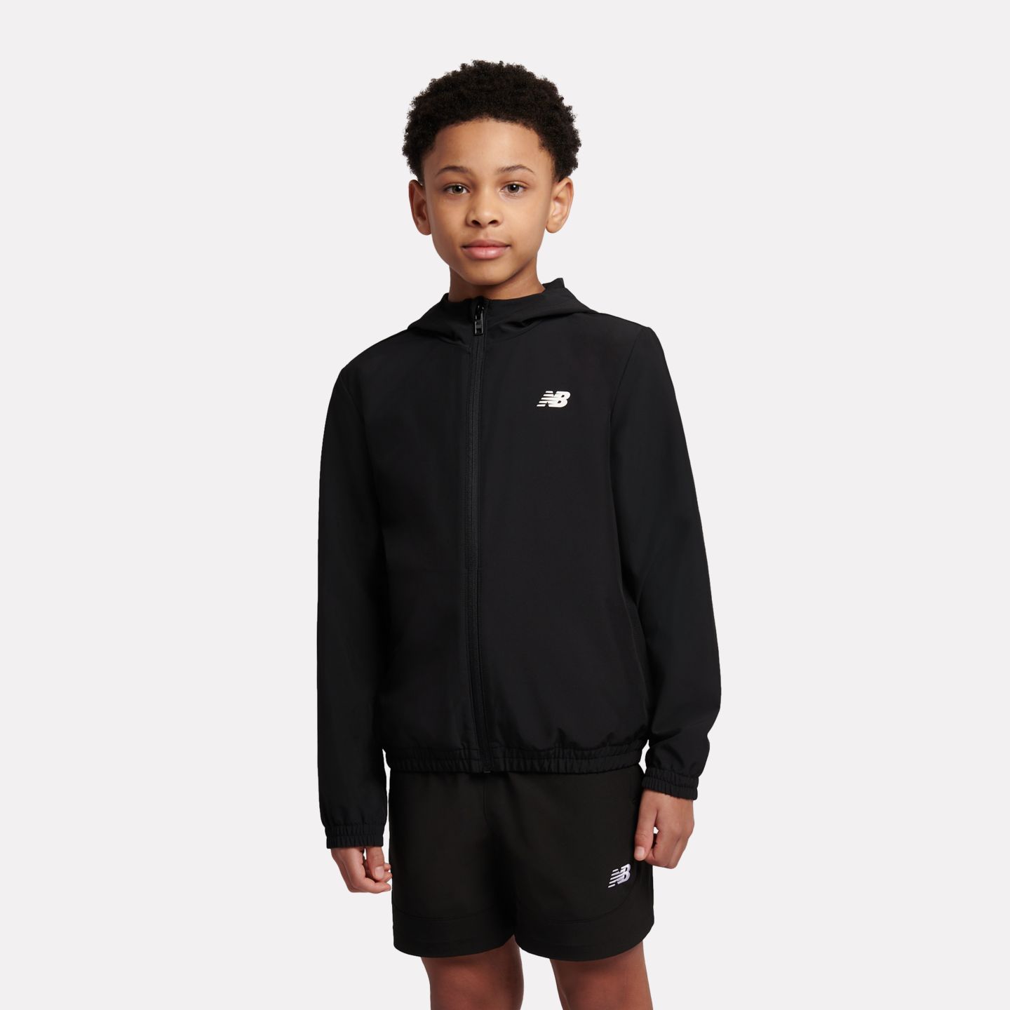 Детская куртка New Balance NB Essential Full Zip Track, цвет: Чёрный — фото 1